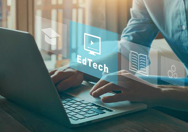 person using computer with EdTech floating in foreground